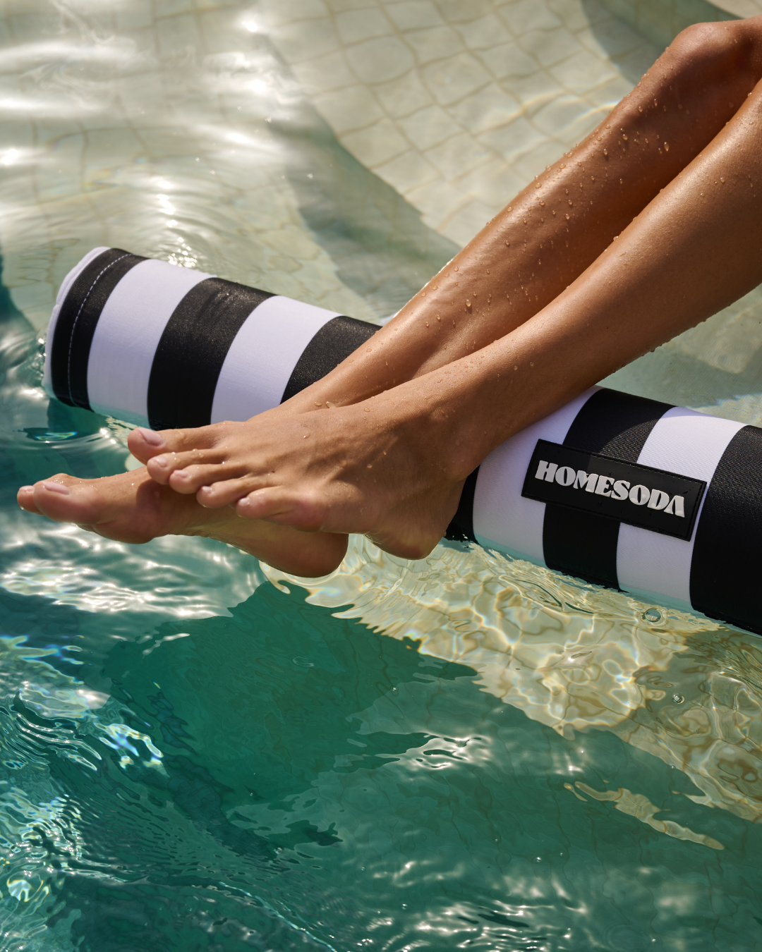 Monochrome striped hammock from homesoda.store made of soft fabric, perfect for relaxing outdoors.