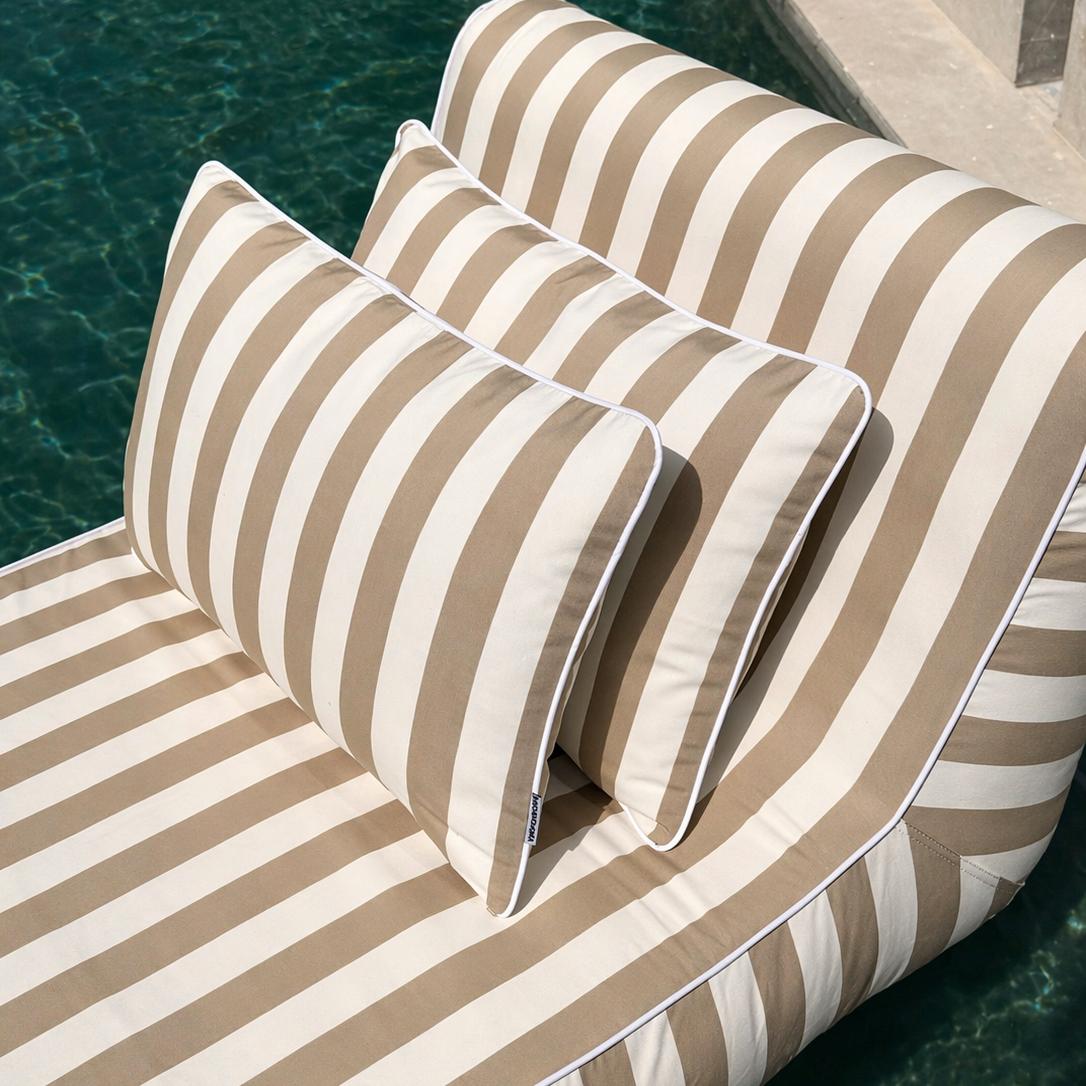 Taupe outdoor cushion set with two 60-inch square cushions from homesoda.store, featuring plush fabric and decorative stitching.